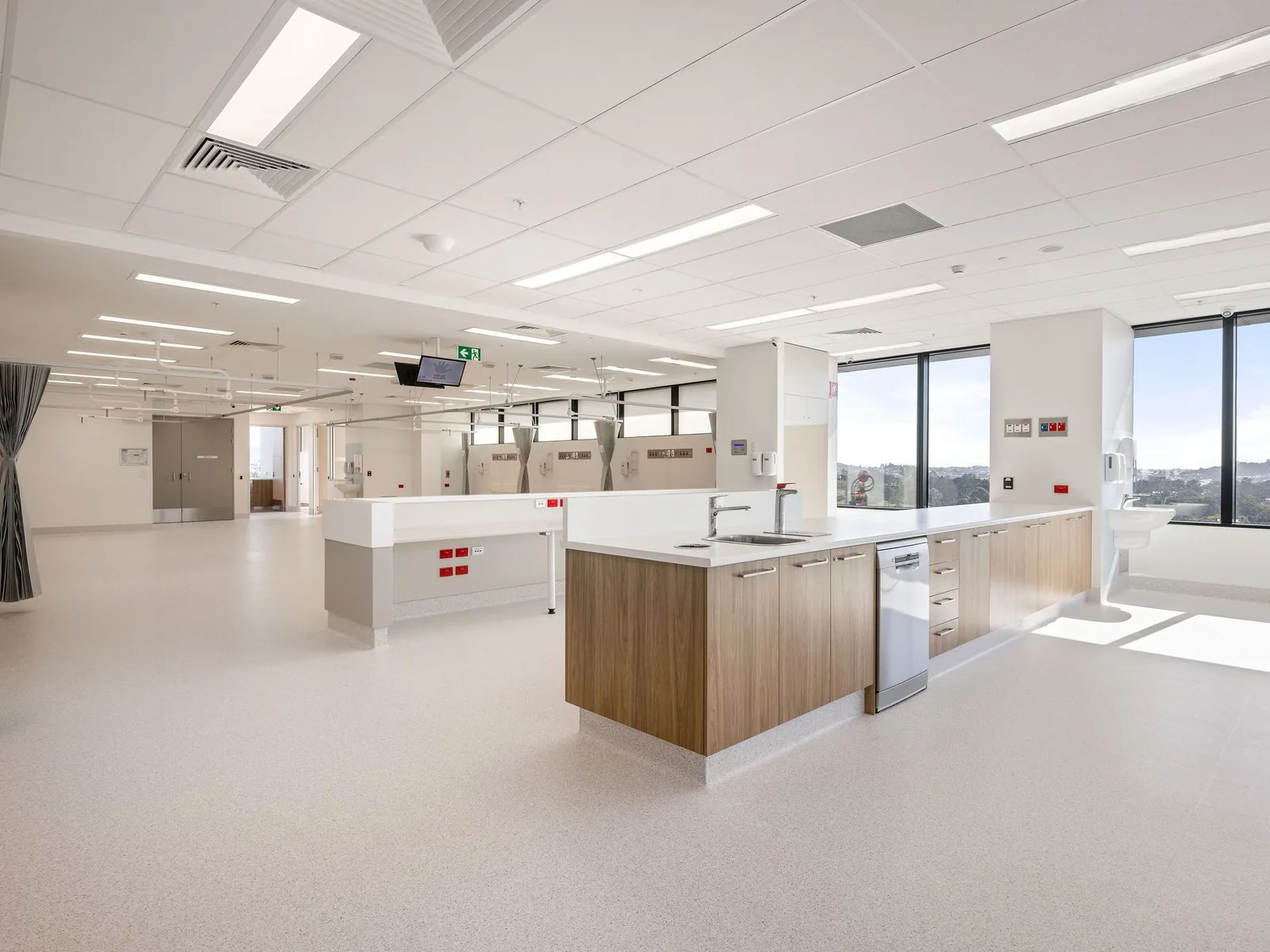 Clinical area and staff station with coved sheet vinyl, Queensland Fertility Group